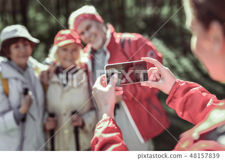 Elderly fashion people posing on phone camera Elderly fashion people posing on phone camera 48157839