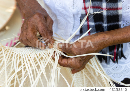 The villagers took bamboo stripes to weave 48158840