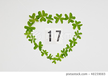 Number 17 to celebrate St Patrick's Day in green heart frame Number 17 to celebrate St Patrick's Day in green heart frame 48159083