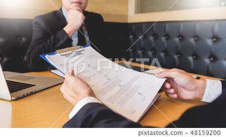 businessman listen to young attractive man explaining about his 48159200