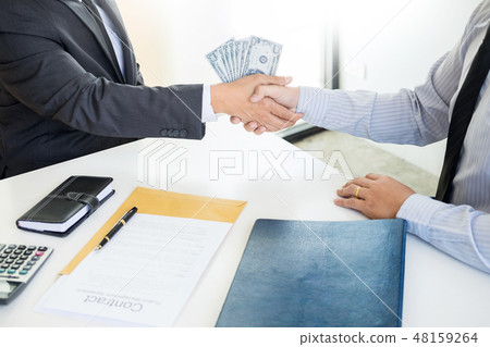Businessman or politician taking bribe and Shaking Hands With Mo 48159264
