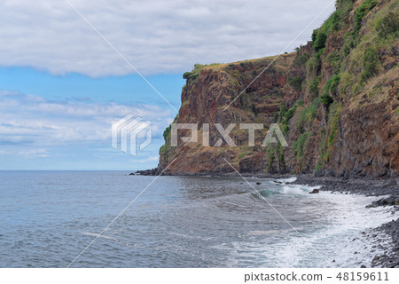 rocky coastline in Calheta. Madeira island 48159611