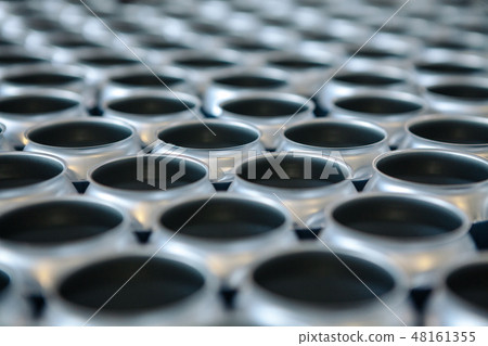 Empty aluminum cans without lids and without etiquette in stock. Close-up Empty aluminum cans without lids and without etiquette in stock. Close-up 48161355