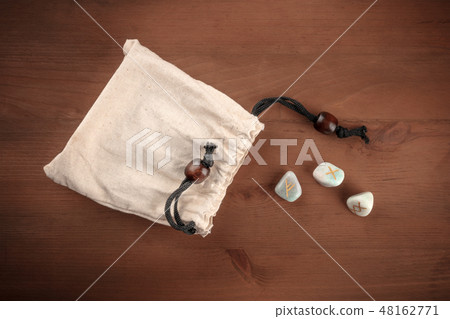 A photo of ancient Norse runes from the Futhark alphabet, stones with symbols used in Wicca and 48162771