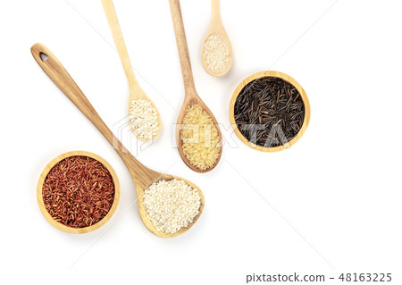 A photo of various types of rice, shot from the top on a white background with copy space. White A photo of various types of rice, shot from the top on a white background with copy space. White 48163225