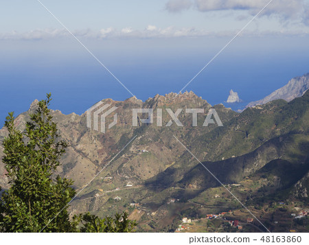 view point Amogoje, green hills with rock in the sea El Draguillo in anaga mountain, tenerife canary 48163860