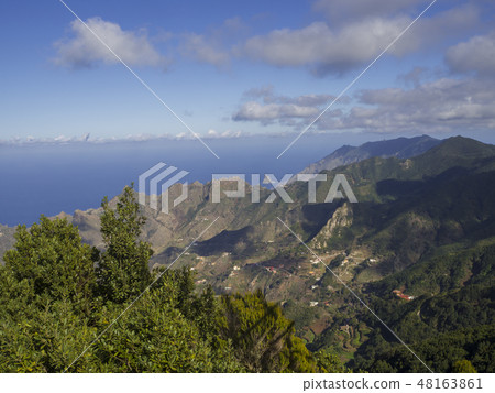 view point Amogoje, green hills with rock in the sea El Draguillo in anaga mountain, tenerife canary 48163861