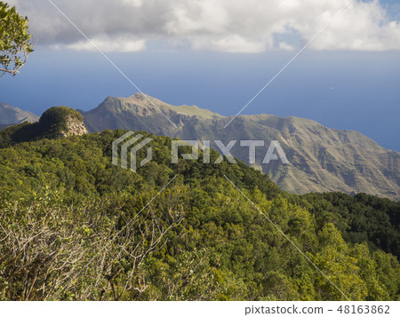 view point Amogoje with pitoresque green hills and bush, sharp rock peaks and sea in anaga mountain view point Amogoje with pitoresque green hills and bush, sharp rock peaks and sea in anaga mountain 48163862