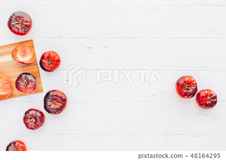 Tomatoes Mar Azul on white wooden table background 48164295