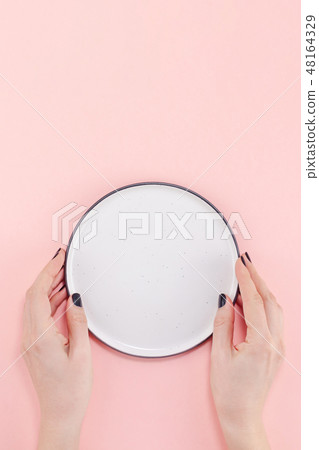 Empty plate in female hands mockup Empty plate in female hands mockup 48164329