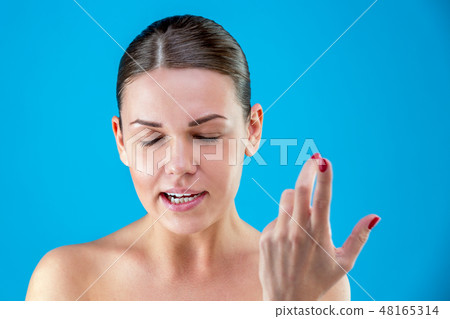 The pretty European young angry brown-haired woman with healthy clean skin, screaming, waving her 48165314