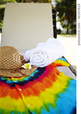 Straw hat and plumeria put on colorful shirt vacation image of summer 48165629