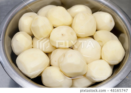 Peeling of potatoes 48165747