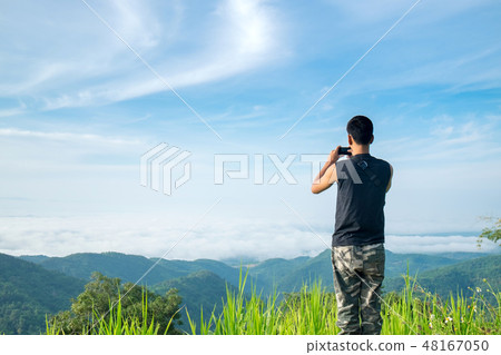 Teenager Tourist Take a Photo of Landscape. Teenager Tourist Take a Photo of Landscape. 48167050