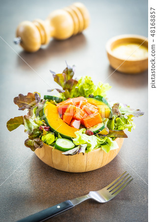 Crab sticks meat with fresh vegetable salad with mayonnaise sauce Crab sticks meat with fresh vegetable salad with mayonnaise sauce 48168857