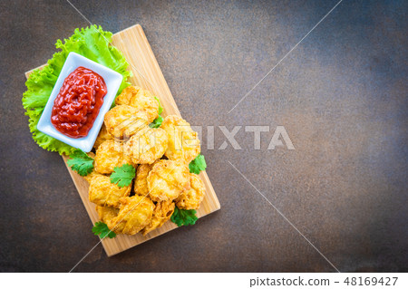 Deep fried chicken meat call nugget with tomato or ketchup sauce Deep fried chicken meat call nugget with tomato or ketchup sauce 48169427
