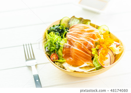 Raw fresh salmon fish meat sashimi with seaweed and other vegetables salad Raw fresh salmon fish meat sashimi with seaweed and other vegetables salad 48174080