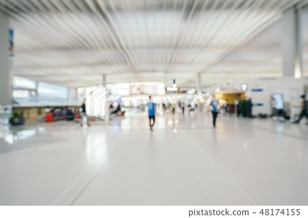 Abstract blur and defocused airport terminal interior Abstract blur and defocused airport terminal interior 48174155