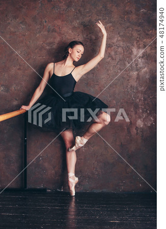 Ballet dancer ballerina in beautiful black dress 48174940