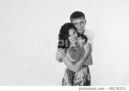 baby on the hands of parents on a white background baby on the hands of parents on a white background 48176252