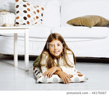 little cute brunette girl at home interior happy smiling close up, lifestyle real people concept 48176887