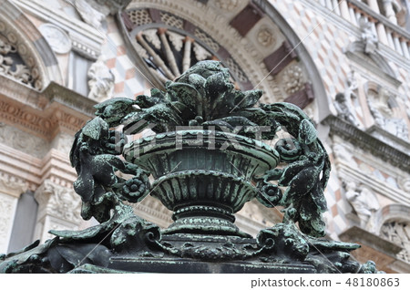 Decoration detail on gate to cathedral in Bergamo 48180863