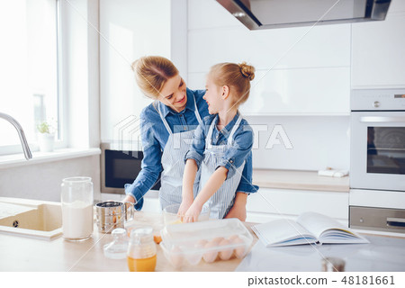 mother with daughter in the kitchen mother with daughter in the kitchen 48181661