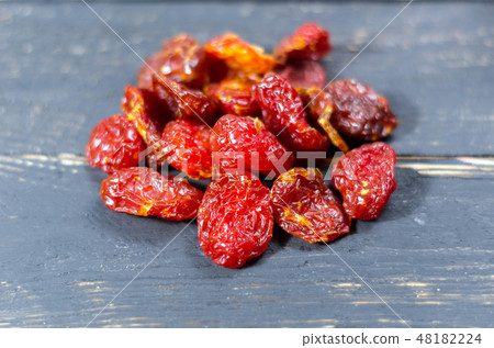 Handful of dried dogwood. Dried berry kizil. 48182224