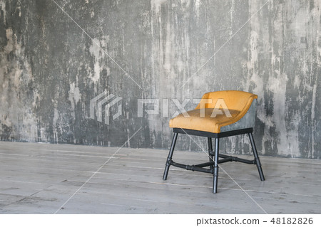 Stool on concrete wall background. Loft room. Wooden floor. daylight. Free space for text. 48182826