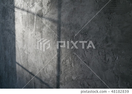 Decorative plaster. Artificial concrete. The texture of the gray concrete wall with a glint of light Decorative plaster. Artificial concrete. The texture of the gray concrete wall with a glint of light 48182839