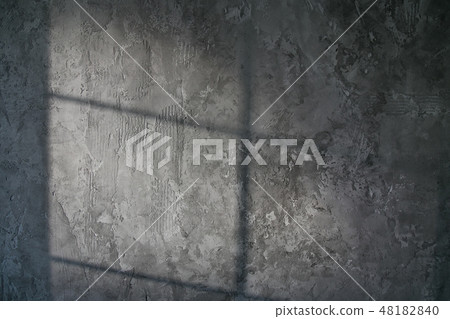 Decorative plaster. Artificial concrete. The texture of the gray concrete wall with a glint of light 48182840