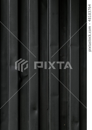 The texture of the marine metallic container is black. Close-up. Transportation of sea cargoes. The texture of the marine metallic container is black. Close-up. Transportation of sea cargoes. 48183764