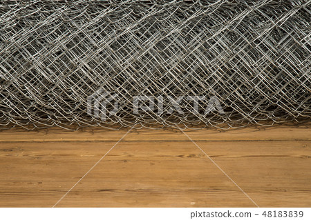 Rabitz grid in a roll on a wooden background 48183839