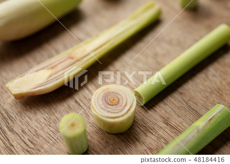lemongrass slices on wood background. 48184416