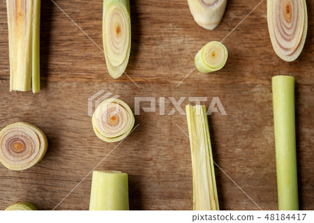 lemongrass slices on wood background. 48184417