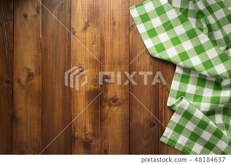 checked cloth napkin at wooden table checked cloth napkin at wooden table 48184637