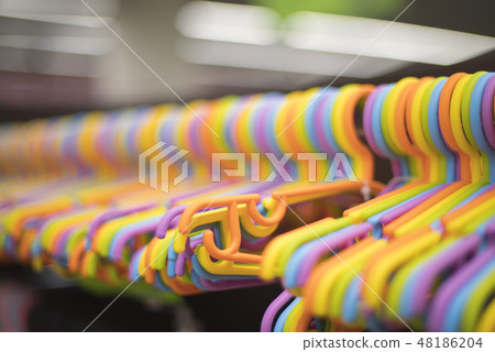 clothes hangers in the store 48186204