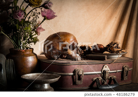 Human skull and flower vase old treasure on wooden 48186279