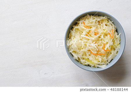 Top view of bowl with cabbage and carrot 48188144