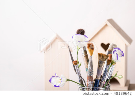 Art Creativity Concept. Brush Set and wooden hous Art Creativity Concept. Brush Set and wooden hous 48189642