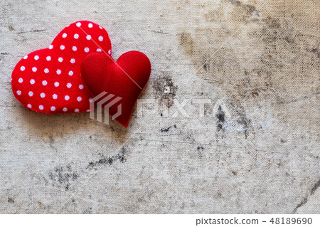 Two hearts on the old canvas background 48189690