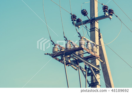 Power lines on sky background 48189692