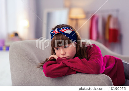 Upset brunette girl being deep in her thoughts 48190953