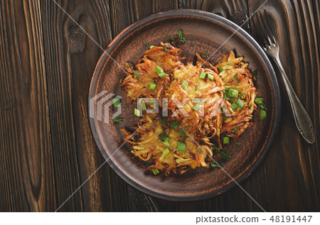 Top view of fresh homemade tasty potato pancakes Top view of fresh homemade tasty potato pancakes 48191447