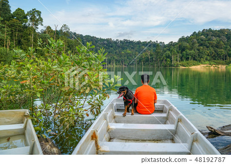 Man and dog spending time outdoor Man and dog spending time outdoor 48192787
