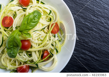 Zucchini pasta noodles tomatoes Healthy vegetarian 48193963