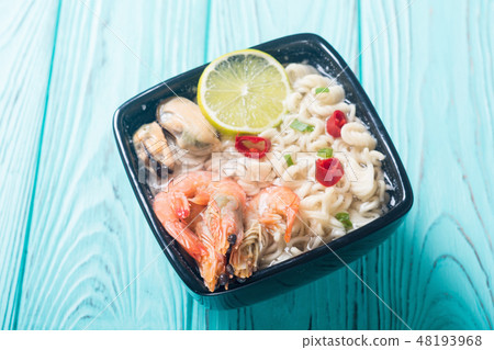 Instant noodles soup shrimps and mssels Asian food Instant noodles soup shrimps and mssels Asian food 48193968