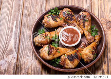 Grilled chicken legs with tomato sauce Grilled chicken legs with tomato sauce 48194321