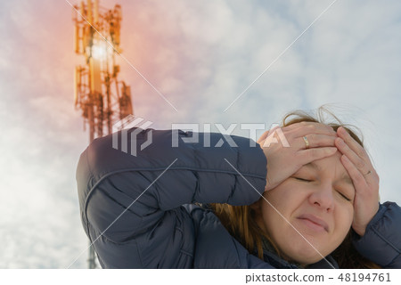 Woman is holding her head near the BTS 48194761