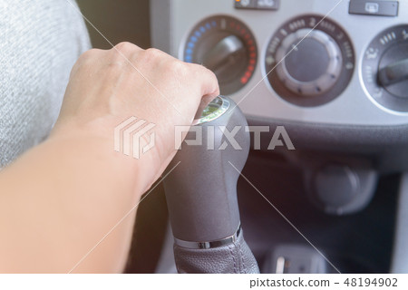 Hand on gear shift lever 48194902